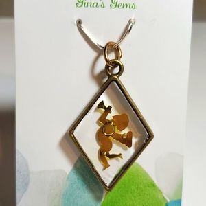 Jewlery pendant resin with angel charm.